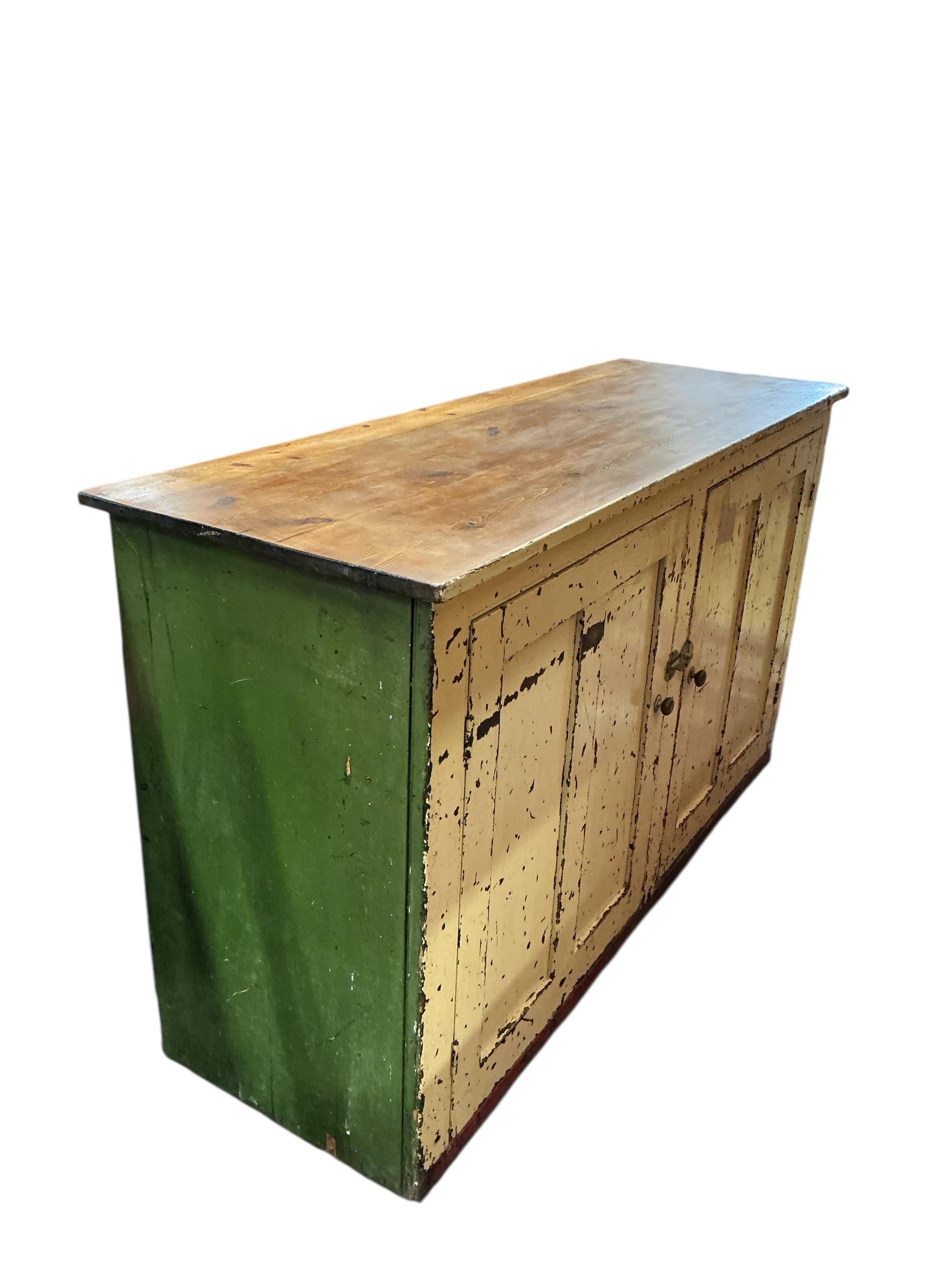 A Victorian painted pine two door household cabinet, width 152cm, depth 53cm, height 89cm